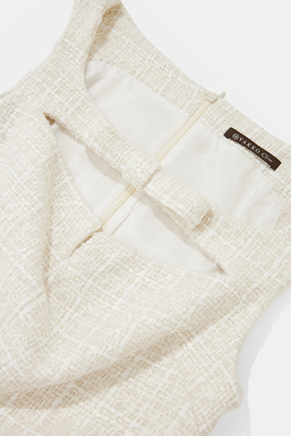 WHITE SLEEVELESS BELOW THE KNEE DRESS 6